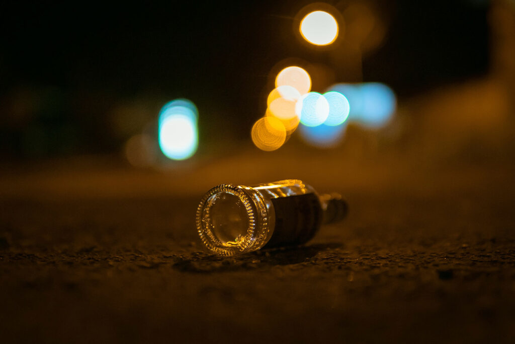 Bottle on the ground, a visualization of what alcohol use disorder is